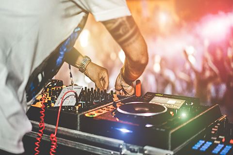 A stock photo of a DJ at a party.